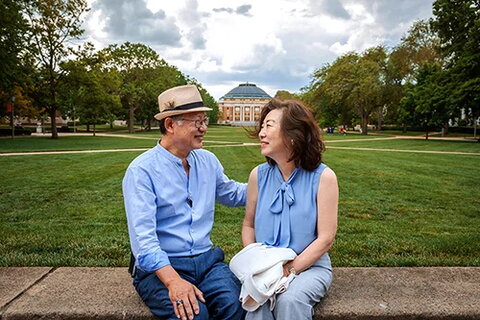 Max and Bonnie Kim sitting on the Quad