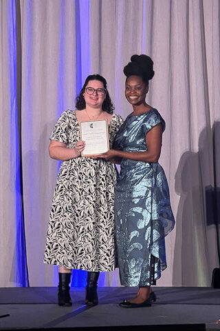 Emily Mendelson accepting the Donald P. Cushman Award