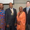 Dixon poses with department and university leadership after being honored