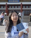 Picture of a student holding books