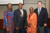 Dixon poses with department and university leadership after being honored